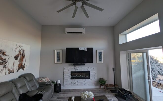 A room with a wall-mounted heat-pump system, wall-mounted